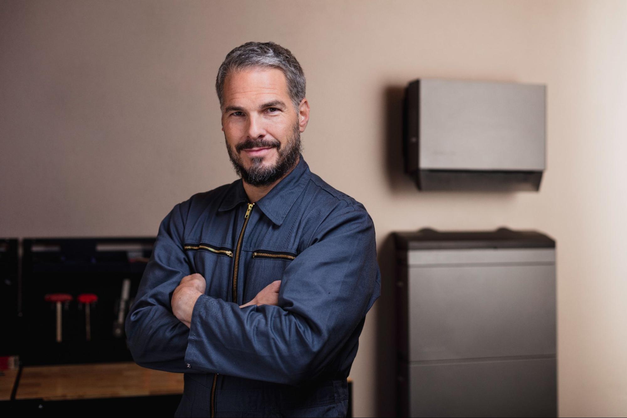 Man standing in front of PowerOcean (Three-Phase)