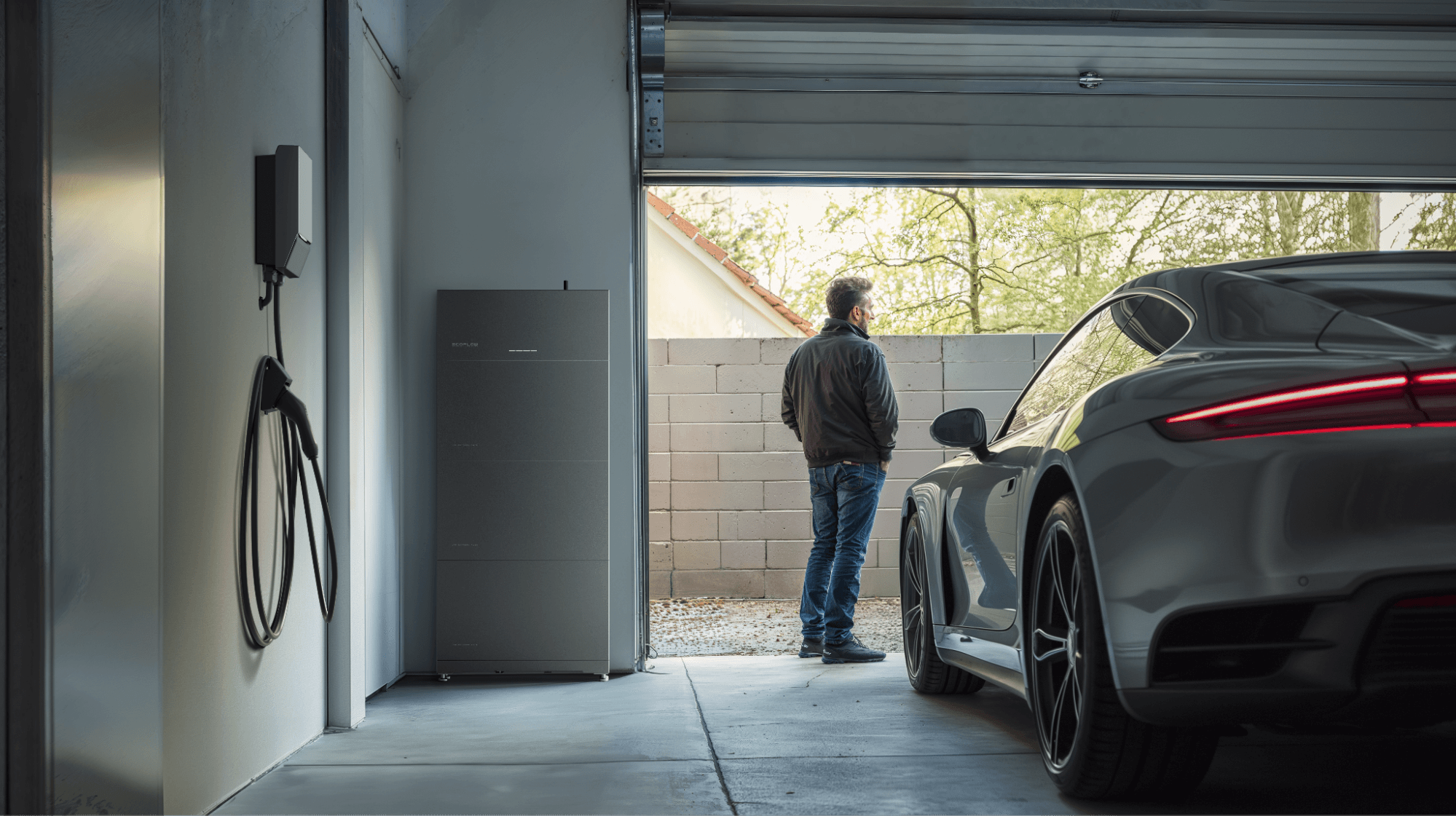 PowerOcean (Single-Phase) install in garage, car and man visible