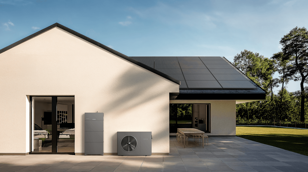 An image of a home with solar panels on the roof and two EcoFlow Home Battery products