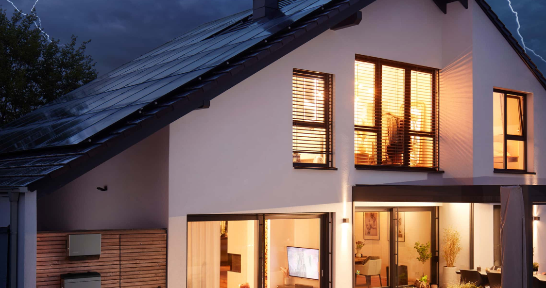 An image of a home lit up in a thunderstorm with an EcoFlow PowerOcean (Three-Phase) in shot